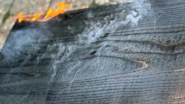 Light smoke rising from Western Red Cedar during early Yakisugi burn.
