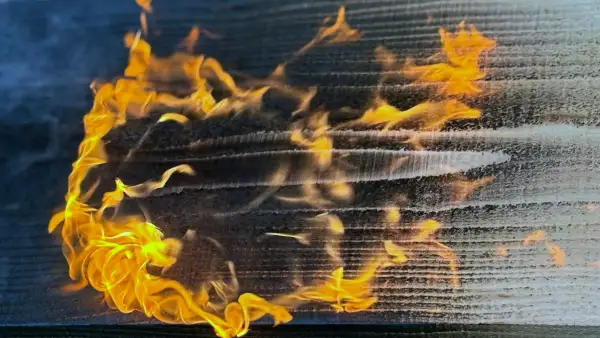 Wide flame sweeping across a Western Red Cedar board during Yakisugi charring.