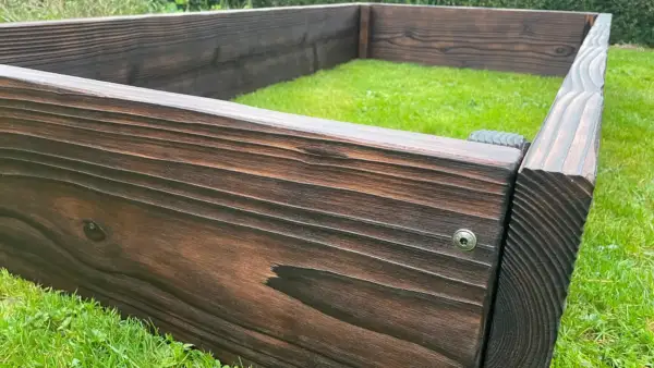 Western Red Cedar raised bed with Yakisugi finish showing a long straight run and thick structural boards